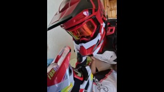 Guy fucks another guy in a motocross outfit